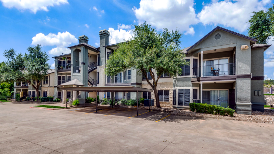 the exterior of an apartment complex in the suburbs at The Stetson