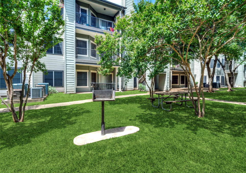 the grassy area in front of the apartment building at The Stetson