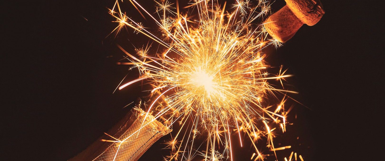 a bottle of champagne with sparklers at The Stetson